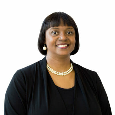 Angelia Johnson at Bank of the James wearing pearl earrings, a pearl necklace and black blouse