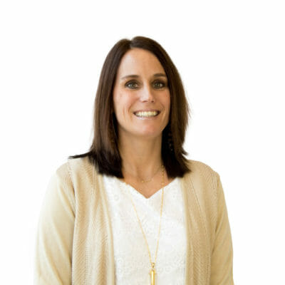 Kellie Hudson at Bank of the James wearing a white blouse, gold sweater and two gold necklaces
